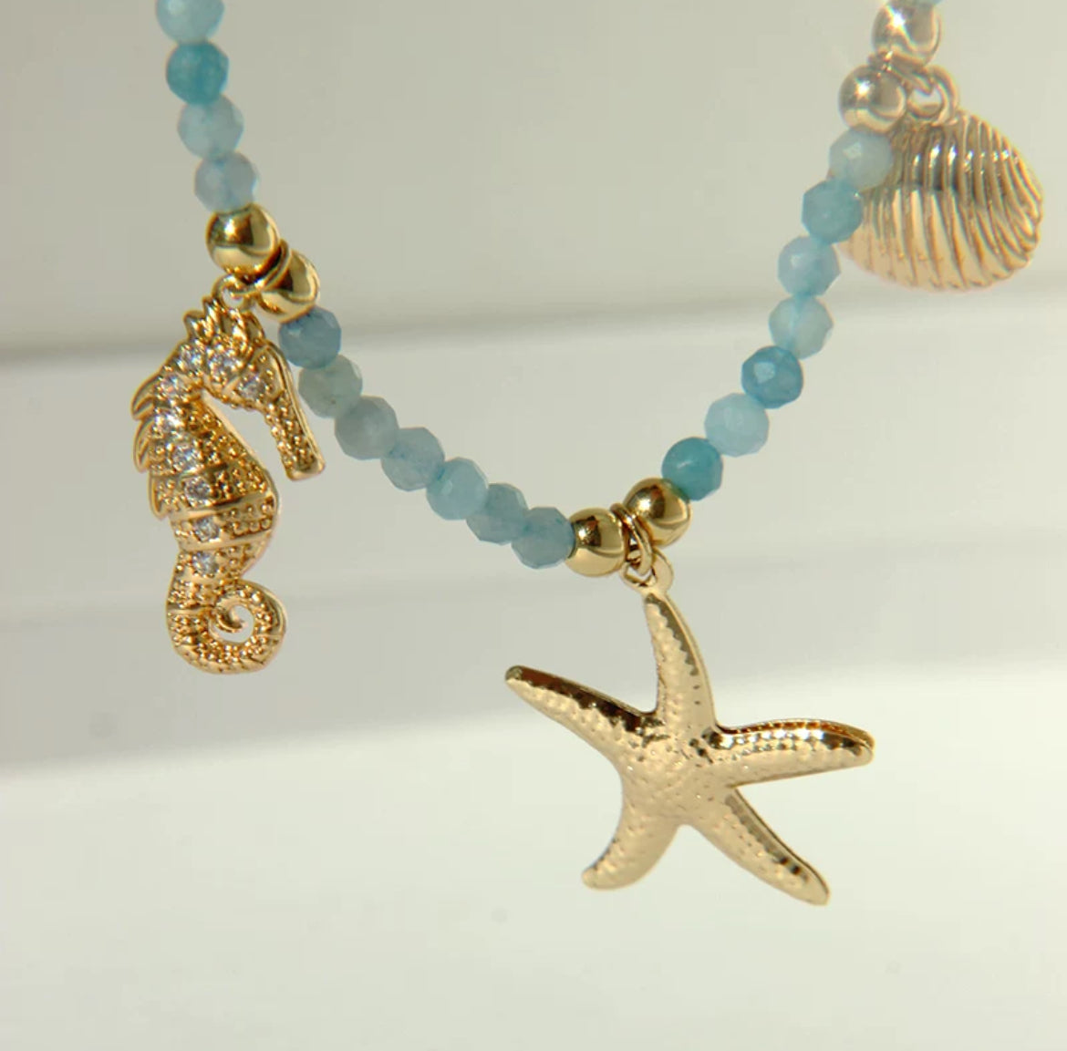 Gold plated sea blue necklace